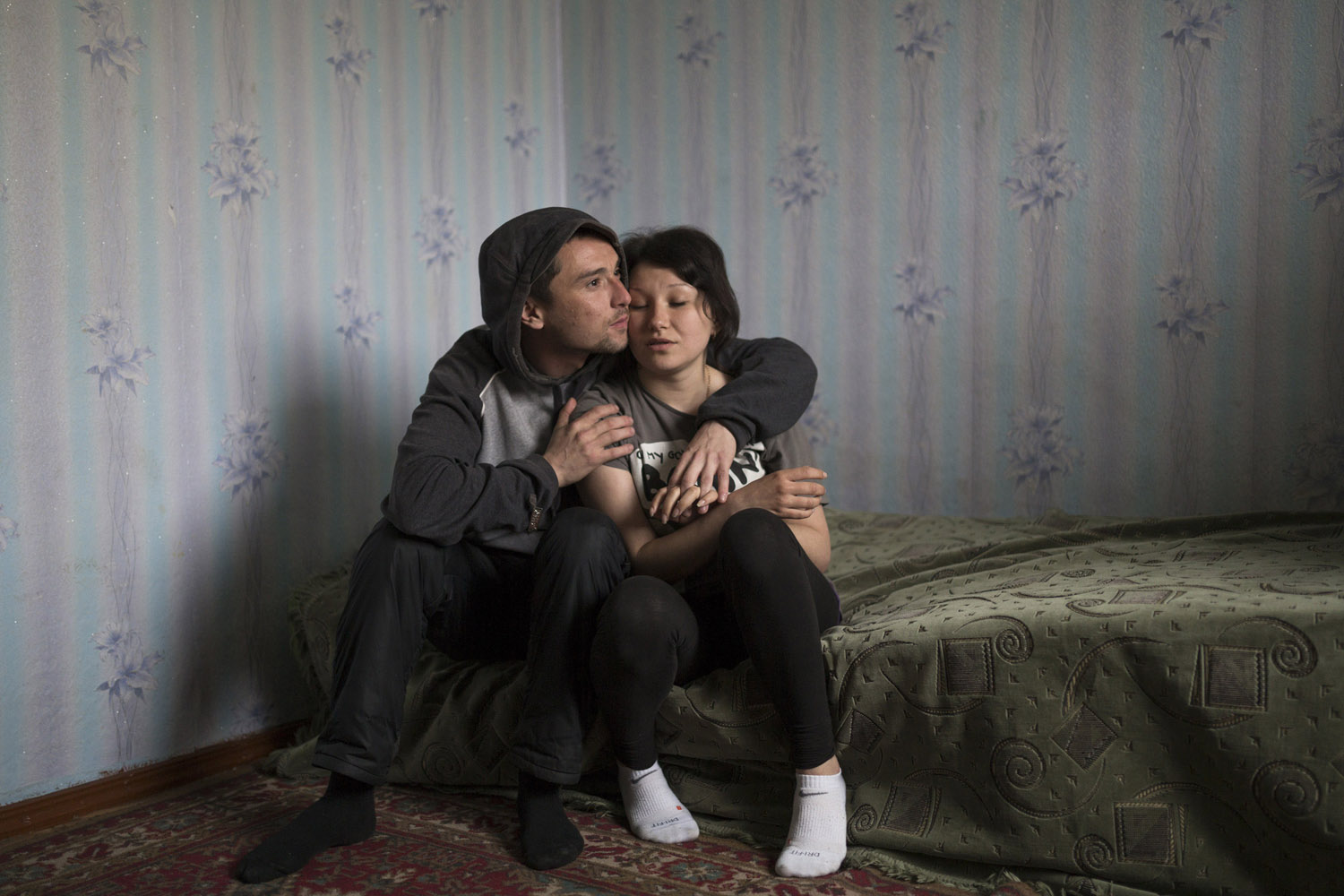 Renat (28) and Regina (20), Shakhtiorsk. He has worked in mines for eight years, mostly in illegal ones. They want to get married, but still have not been able to save enough money to do so.