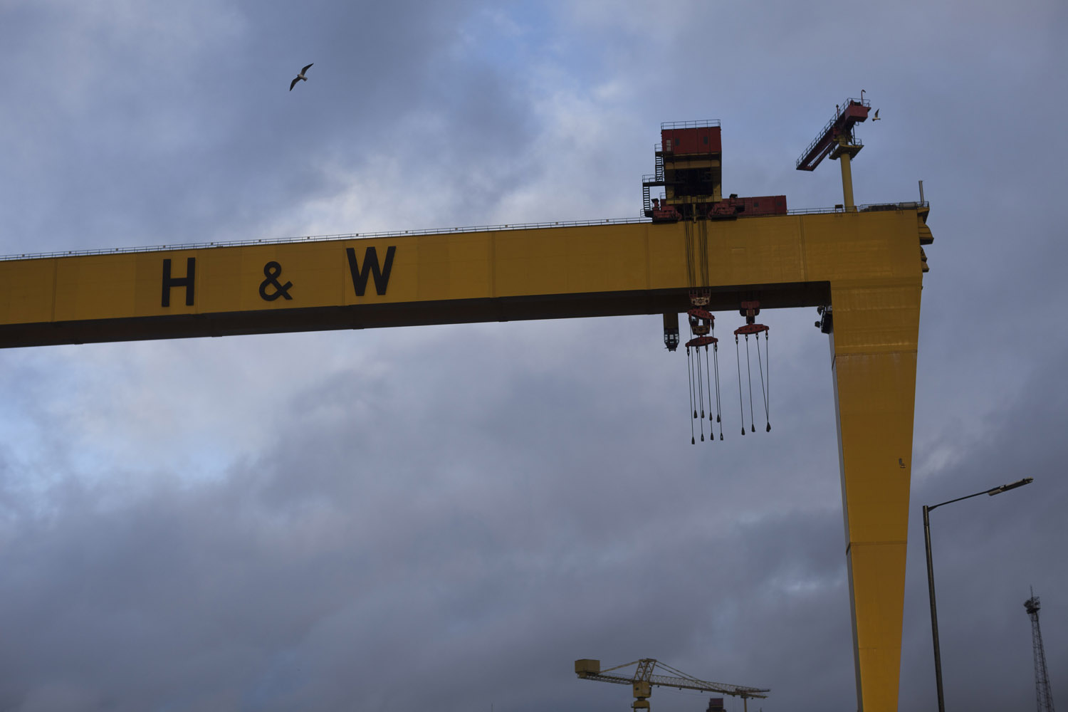 The “Samson and Goliath” cranes at the shipyards of Belfast, one of the city's main landmarks. These shipyards built the Titanic and once employed tens of thousands of workers, mostly drawn from the Protestant part the city, East Belfast. With the economy in crisis, the rest of the docks are slowly being turned into a business and leisure development and the shipyards are mostly deserted, yet they remain a powerful symbol of the working class history of the city, especially among the Protestant population.